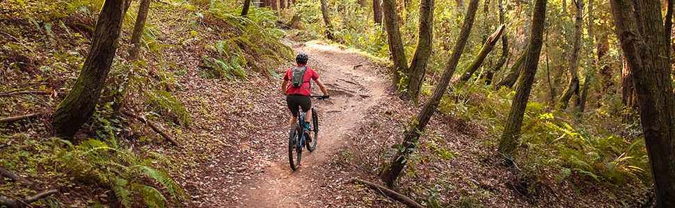 biker on path, camelbak, hydration pack, bike hydration pack, biking pack, cycling pack