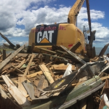 Removing dock debris, with large construction equipment, left in the wake of Hurricane Florence.