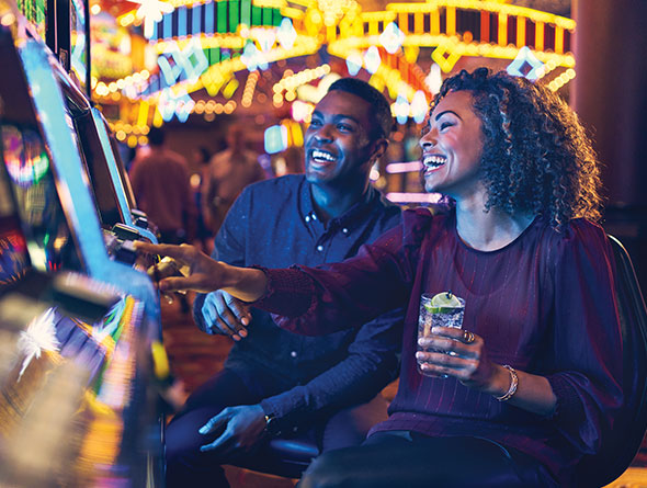 couple playing slots image