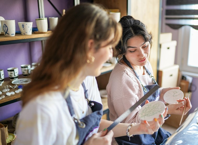 Two women making ceramics at ceramic workshop