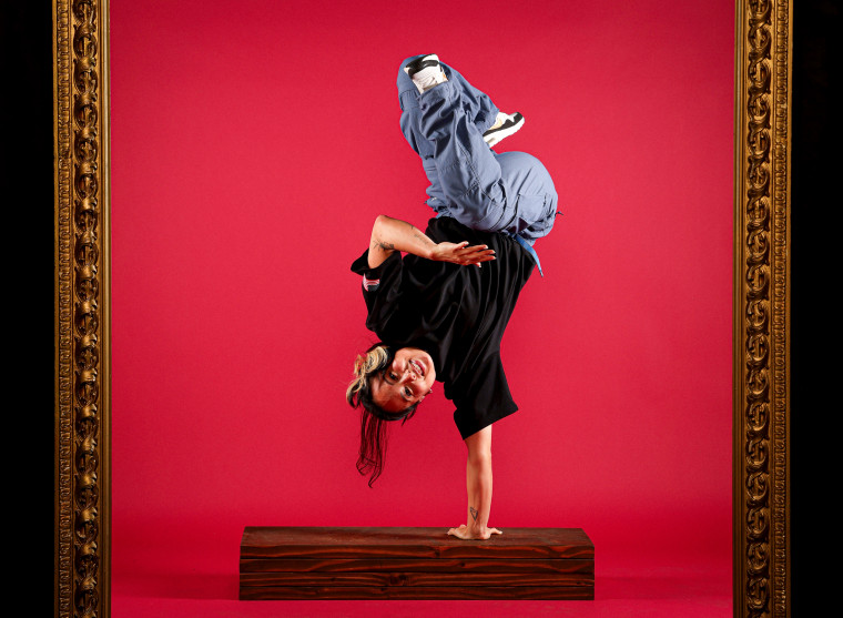 Breakdancer Sunny Choi poses upside down.