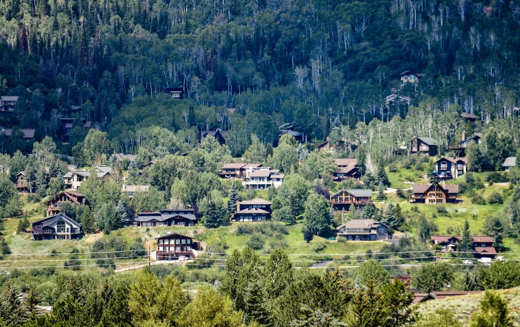 Houses dot a hillside in Steamboat Springs, Colo.