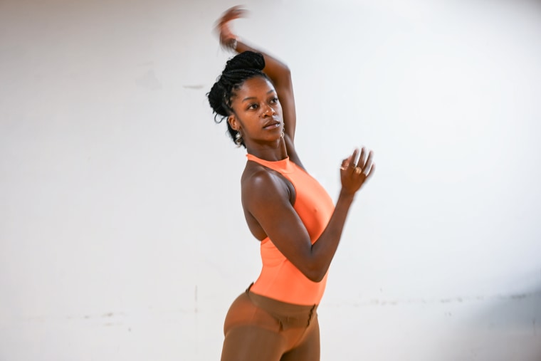 Lenai Alexis Wilkerson dances, her arms in motion