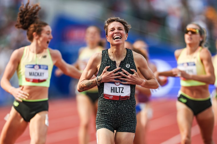 Nikki Hiltz celebrates after crossing the finish line on the track