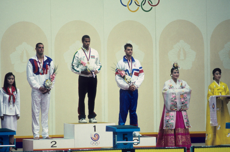 Anthony Nesty receives gold medal at 1988 Summer Olympics in Seoul.