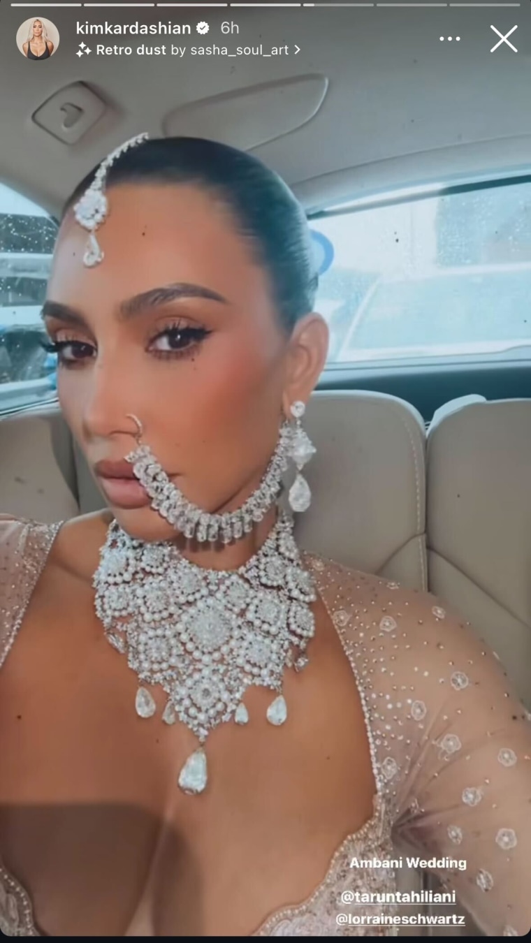 Kim Kardashian shows off face jewelry for Ambani wedding. 