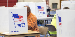 Voters fill out ballots at Bedford High School during the New Hampshire Primary on Sept. 13, 2022, in Bedford.