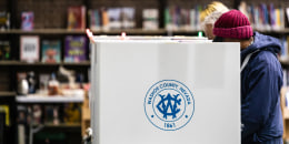 Voters cast their ballots at the Downtown Reno Library in Washoe County 