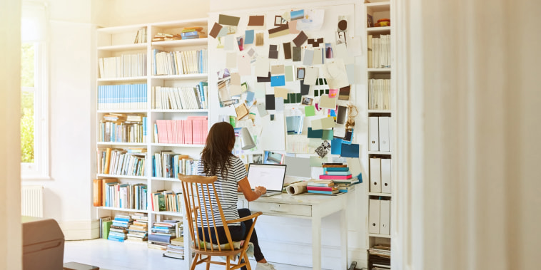 Image: A woman works at home