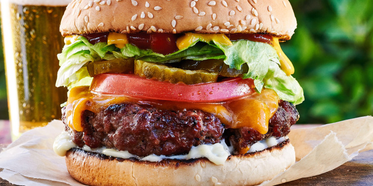 If you press a little dimple into the center of each patty, that will keep the burgers from puffing up in the center, so you have a flatter surface for all your favorite toppings.