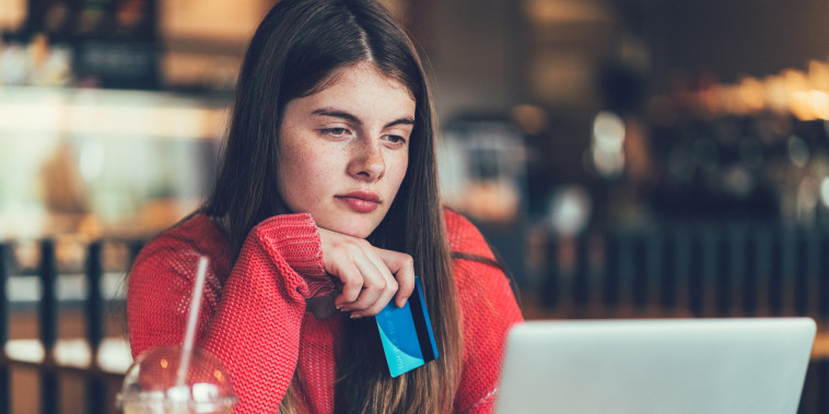 Girl shopping online with credit card