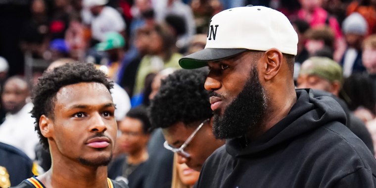 Bronny James and his Lebron James at a game in Houston in 2023