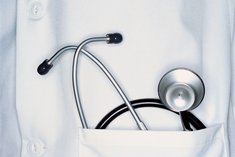 Stethoscope in doctors white pocket