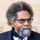 Cornel West stands outside