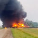 Rail cars containing hazardous material derailed and burst into flames early Friday in a remote area of North Dakota, but emergency officials say no one was hurt and the threat to those living nearby appears to be minimal. 