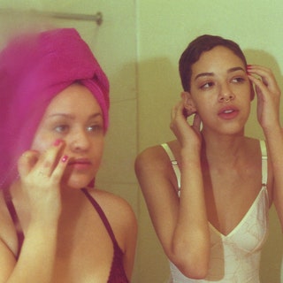 two women in front of the mirror