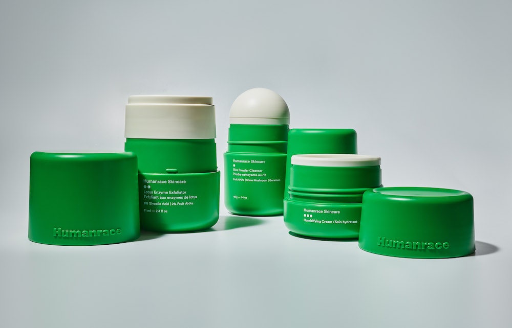 Pharrell Williams' Humanrace skincare collection three green jars of varying heights have their caps removed to reveal...