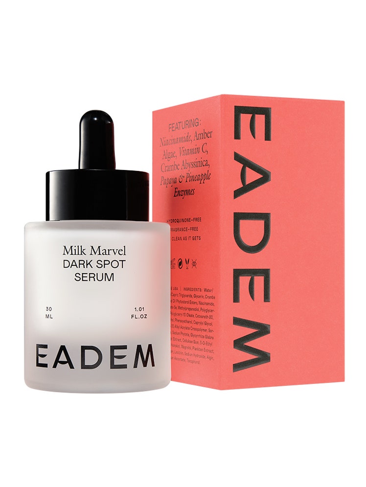 A milky white bottle of Eadem Milk Marvel Dark Spot Serum and red box on white background