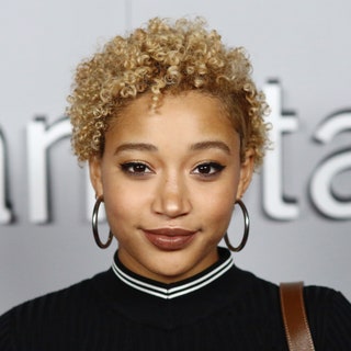 Amandla Stenberg with a short blonde curly pixie cut