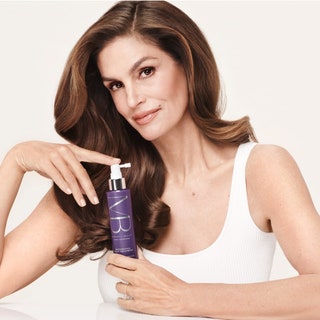 Cindy Crawford holding a Meaningful Beauty product