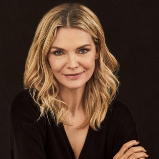 Michelle Pfeiffer posing in a black sweater