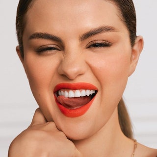 Selena Gomez makes a funny face in red lipstick