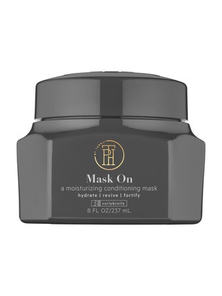 A black tub of TPH Mask On Conditioning Mask on white background