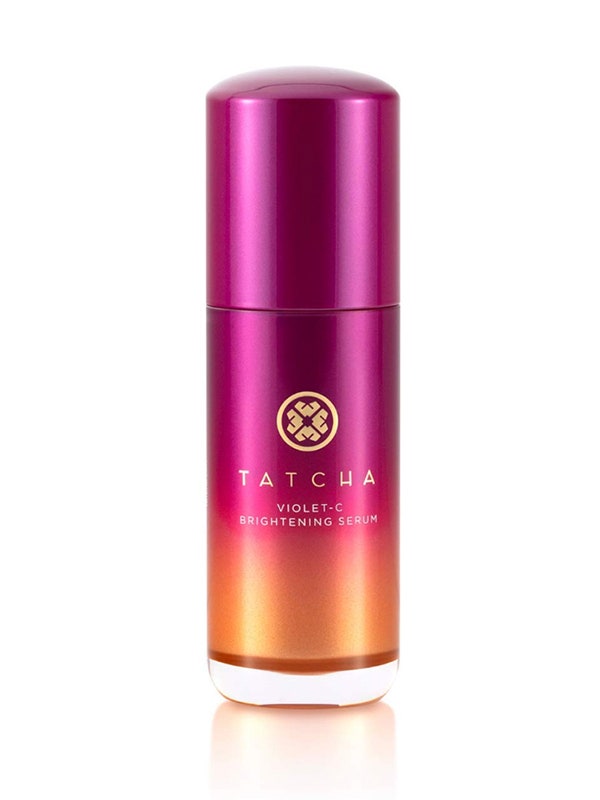 A face serum bottle with an orange-to-purple gradient pattern of the Tatcha Violet-C Brightening Serum on a white background