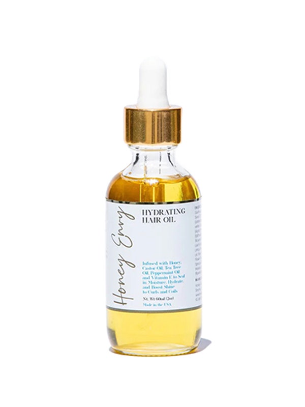 Honey Envy Hydrating Hair Oil serum serum bottle on white background