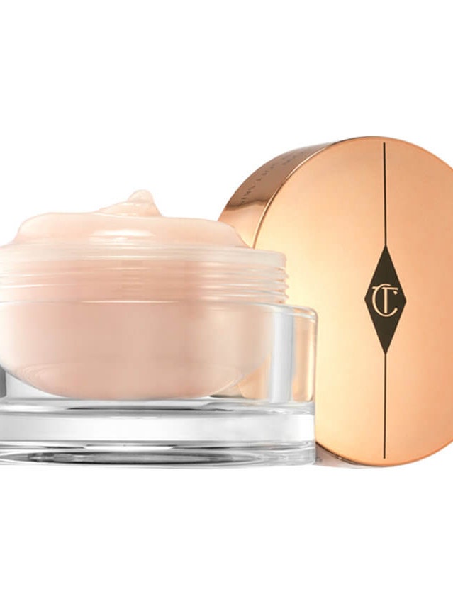 Charlotte Tilbury Multi Miracle Glow jar with pink cream and gold lid on white background