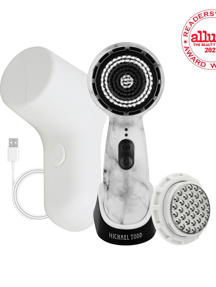 Soniclear by Michael Todd Beauty black and white face washing brush with white case and white and red RCA seal in the top right corner on white background