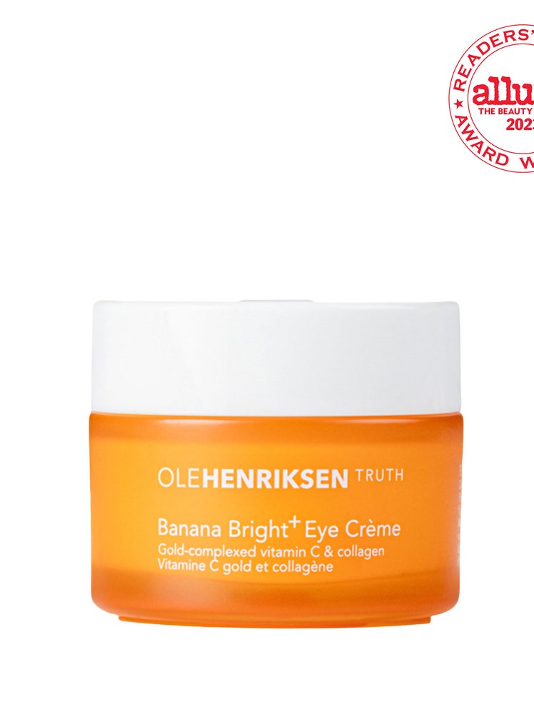 Ole Henriksen Banana Bright Eye Crème orange jar with white lid on white background with white and red RCA seal in the top right corner 