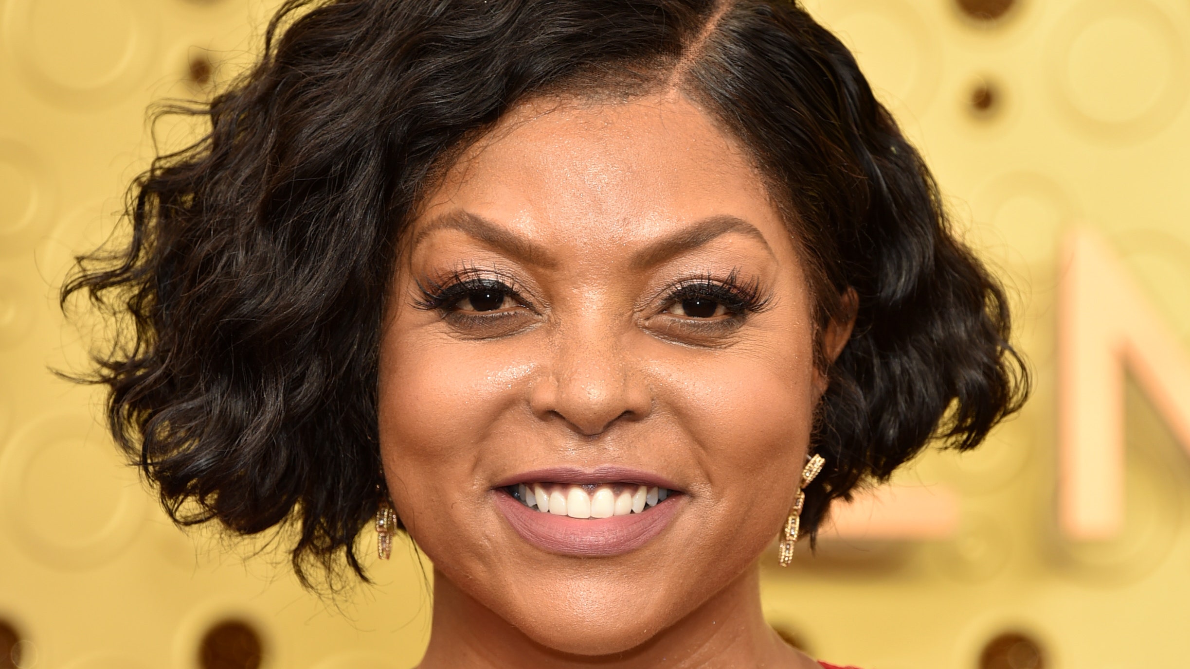 headshot of taraji p henson smiling with a wavy bob