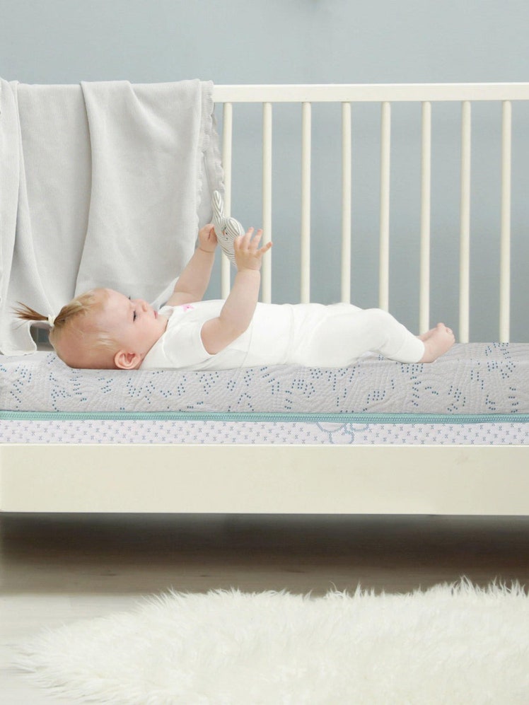 SleepOvation Baby Mattress white crib with mattress in bedroom