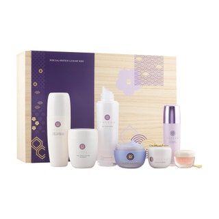 Tatcha Special Edition Luxury Kiri Box white box with white and purple skincare products in front of it on white background