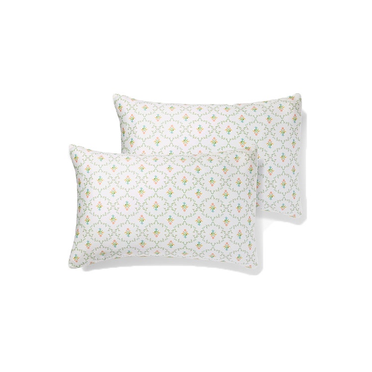 Hill House Pastel Trellis Pillowcase Set: Two white pillows with a multi-colroed pastel trellis pattern on a white background