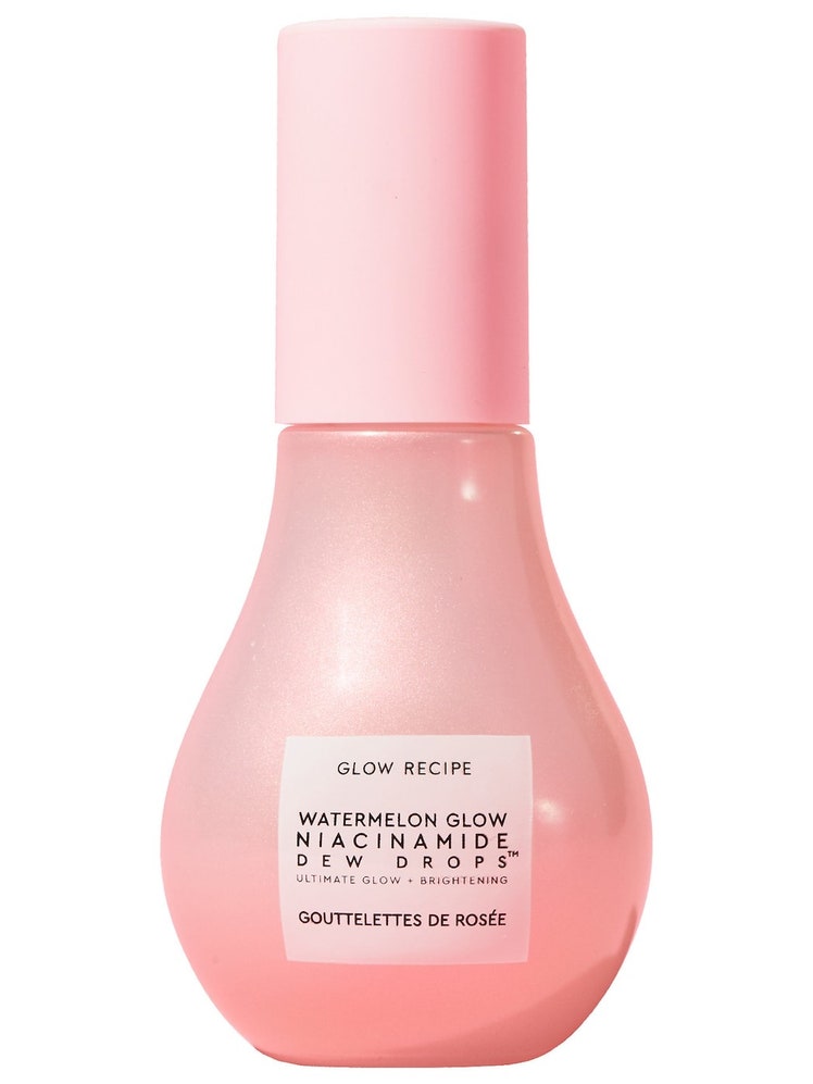 A pink, glass serum bottle with a pink cap