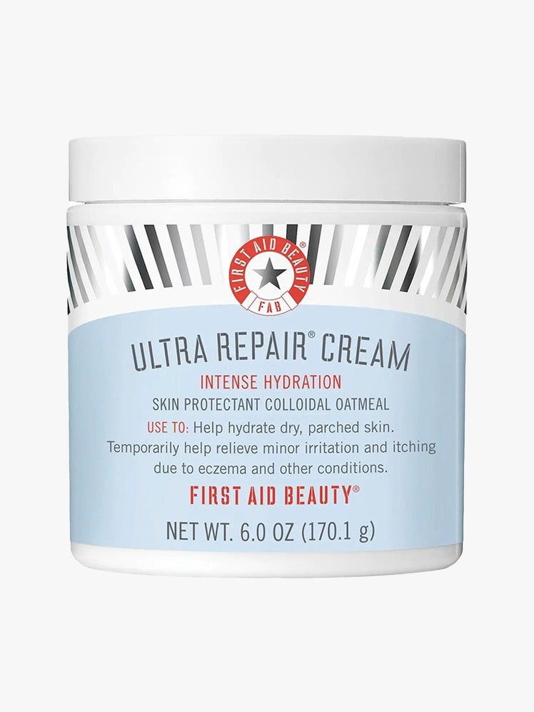 First Aid Beauty Ultra Repair Cream light blue and white jar on light gray background