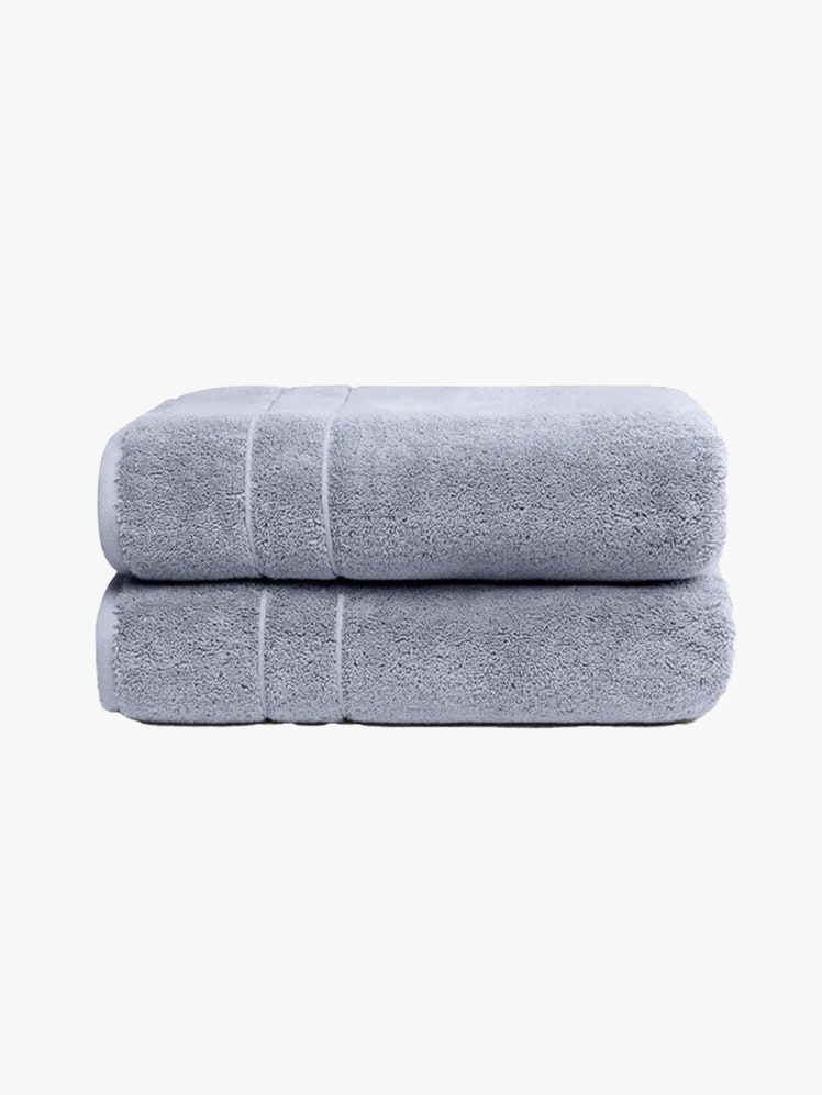Brooklinen Super Plush Bath Towels two folded blue towels on light gray background