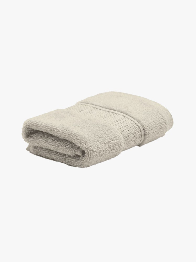 Riley Home Plush Bath Towel folded beige towel on light gray background
