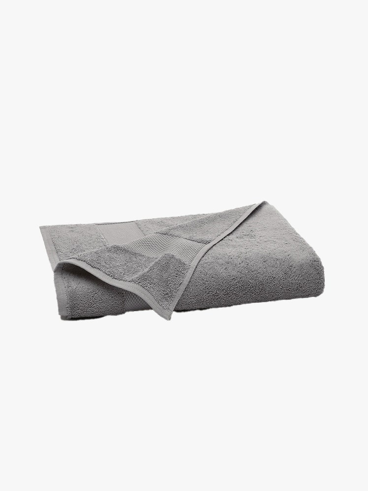 Boll & Branch Softest Organic Plush Bath Towel folded dark gray towel on light gray background