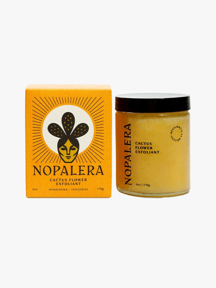 Nopalera Mandarina Cactus Flower Exfoliant orange box next to jar with yellow contents on light grey background