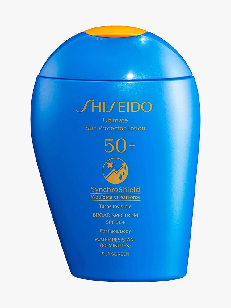 Shiseido Ultimate Sun Protector Lotion SPF 50+ Sunscreen upside down teardrop shaped bottle of sunscreen with flat bottom on light gray background