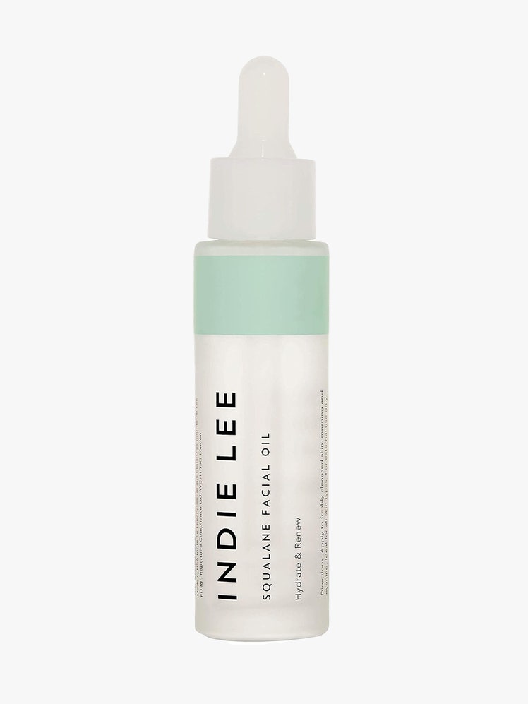 Indie Lee Squalane Facial Oil tall skinny white serum bottle on light gray background