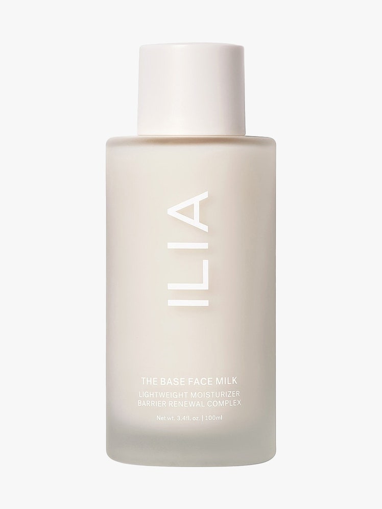 Ilia The Base Face Milk cloudy bottle of milky essence with white cap on light gray background