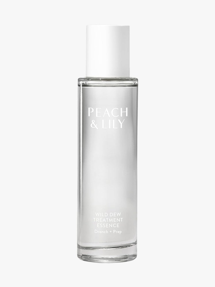 Peach & Lily Wild Dew Treatment Essence clear bottle with white cap on light gray background