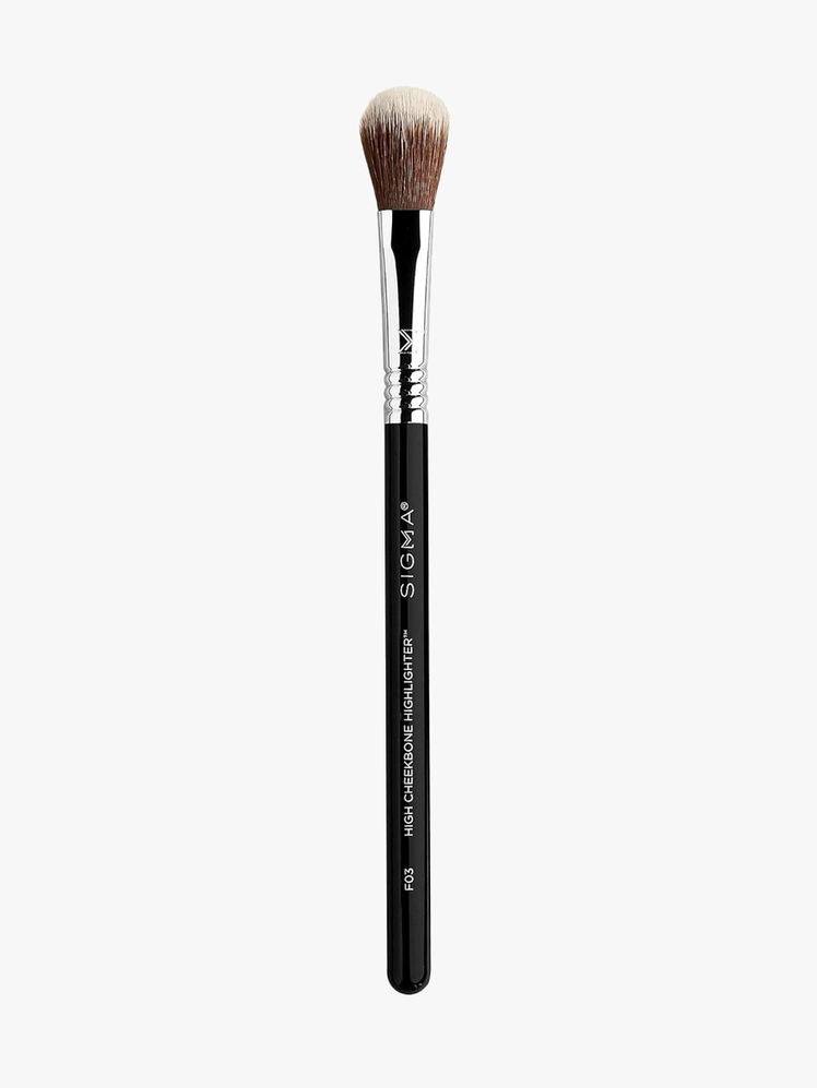 Sigma Beauty F03 High Cheekbone Highlighter with black handle on light gray background