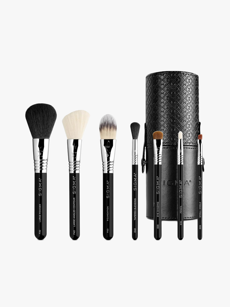 Sigma Beauty Travel Makeup Brush Set with seven different brushes with black handles with branded black brush case with light gray background