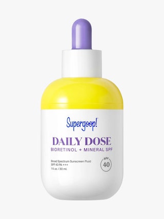 Supergoop Daily Dose Bioretinol  Mineral SPF 40 with Bakuchiol white and yellow bottle with white and purple dropper cap...