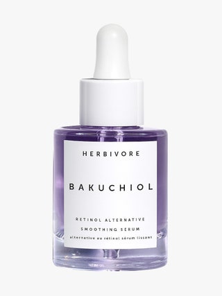 Herbivore Botanicals Bakuchiol Retinol Alternative Smoothing Serum bottle of purple serum with white dropper cap on...